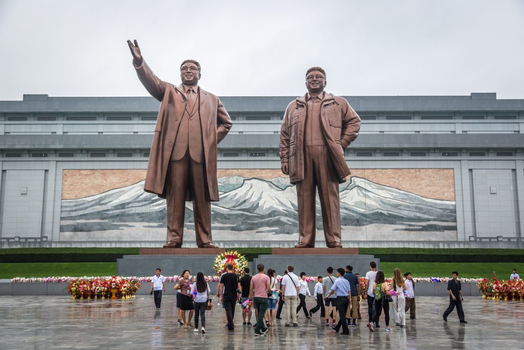 Pyongyang, North Korea – August 5th 2016 – Locals and tourist in front of the Northern Korea leader statue in a cloudy day. Pyongyang, North Korea (editorial use)